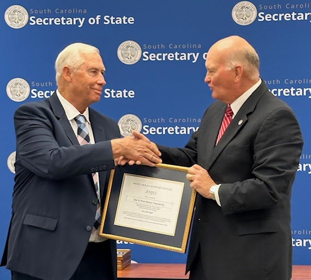 Ron Kaufman receiving 2025 Angel Award on behalf of Ride to Work Ministry.